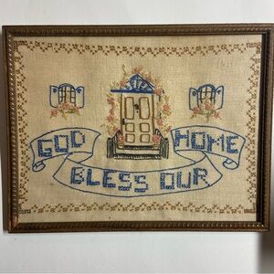 Antique embroidered wall art with original frame.